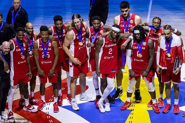 The Canadian basketball team celebrates after winning third place in the FIBA ​​World Cup