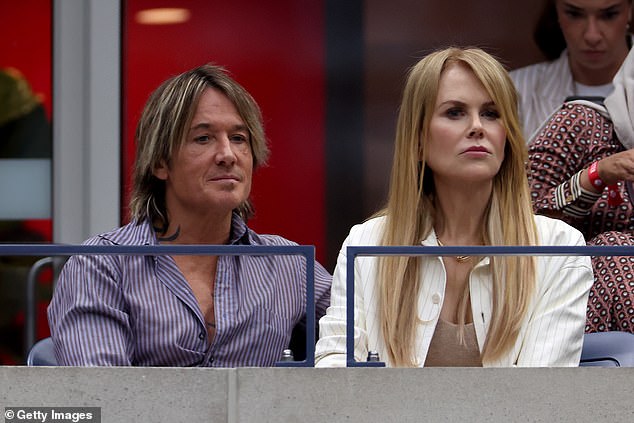 The 56-year-old actress looked incredibly chic while watching the match, wearing a low-cut beige knit top under a white striped blazer