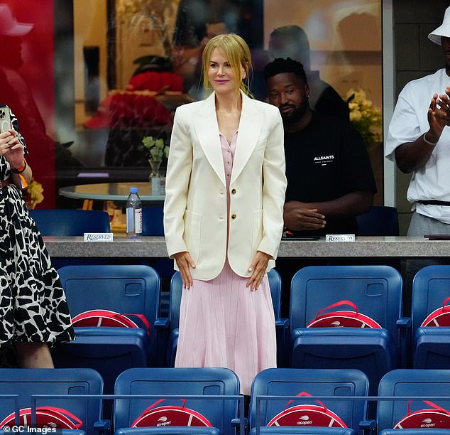 Nicole completed her look with a fitted white jacket and cream loafers, and kept her accessories to a minimum with a simple wristwatch