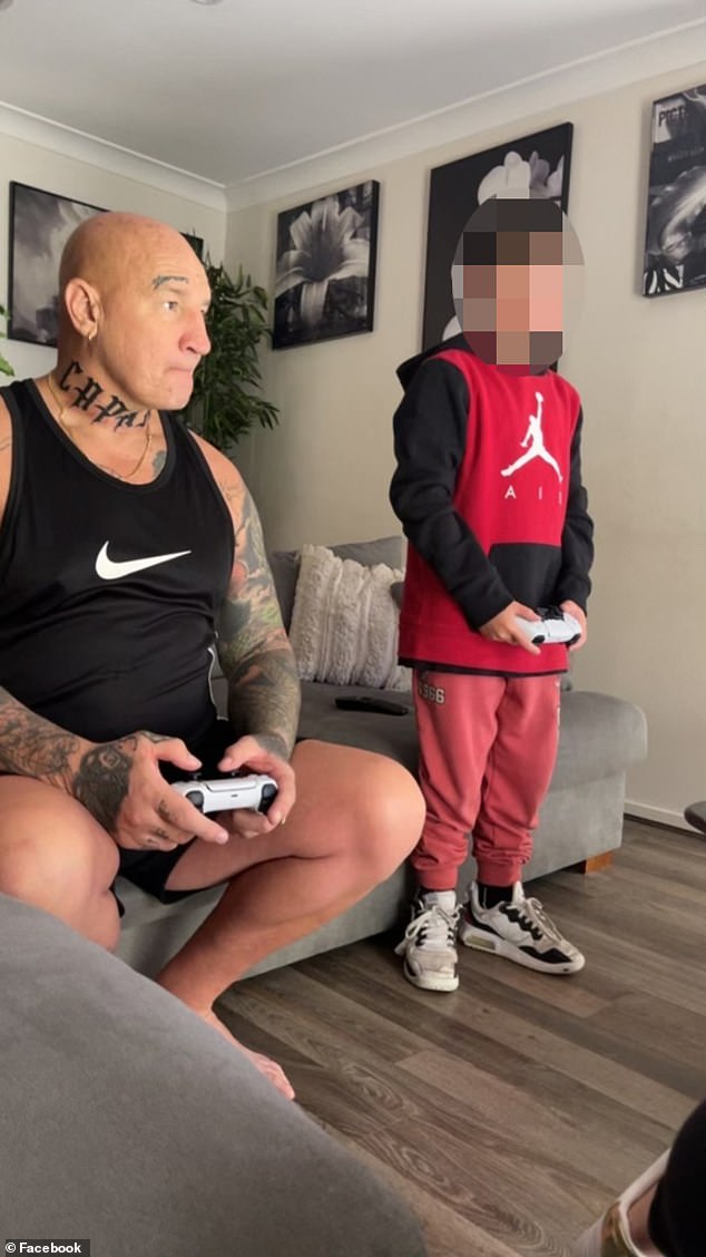 A relaxed Gavin Preston enjoys a game with a young boy in an image he shared on social media before his death