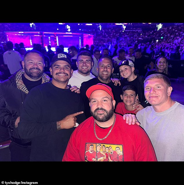 NRL star Latrell Mitchell (second from left) was photographed in the action with boxing promoters George (left) and Matt Rose (front)