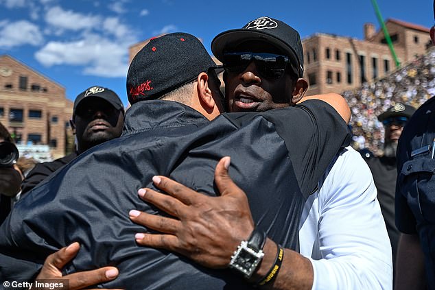 Nebraska Cornhuskers head coach Matt Rhule and Colorado Buffaloes head coach Deion Sanders embrace after Coach Prime improved to 2-0 on the season