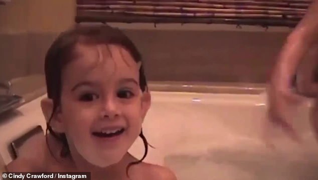 Cute: A home video montage showed little Kaia splashing around in a bathtub