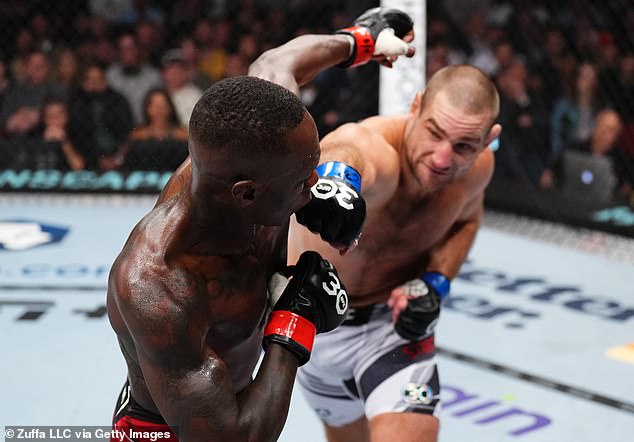 The NSW Premier watched Sean Strickland (right) beat Israel Adesanya (left) in a huge upset - and later admitted his wife wouldn't let him take their kids to see the fight card