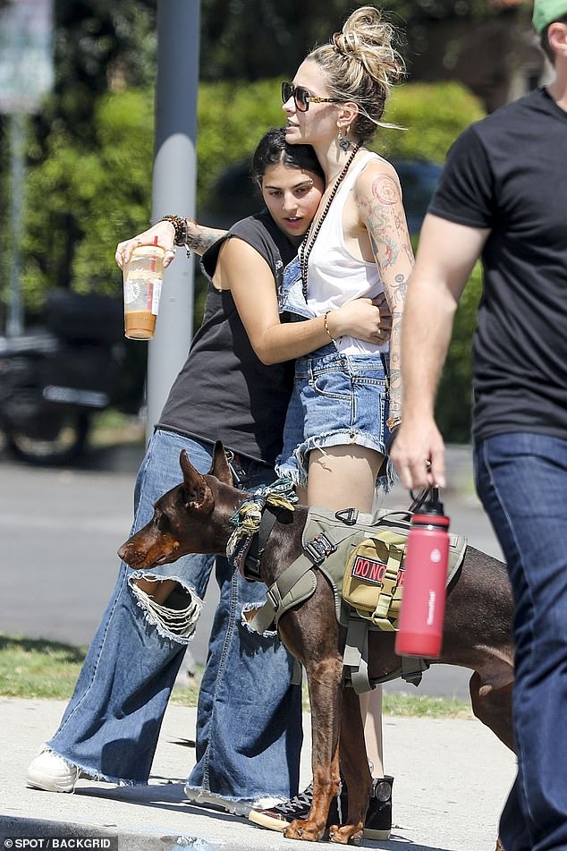 Hugging: At one point, the Bandaid singer stopped her walk for a quick chat with an apparent fan, who looked like a teenager