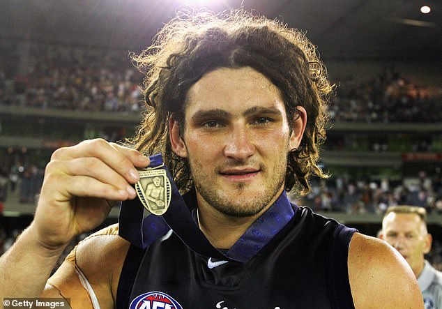 Fevola with the Michael Tuck Medal for best on ground after the Blues defeated the Eagles in the 2005 AFL Wizard Cup grand final