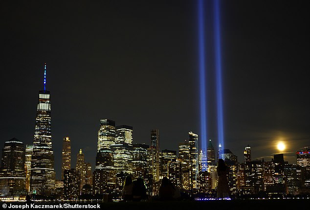 Light shines from Ground Zero, where the World Trade Center stood before the terrorist attacks on September 11, 2001