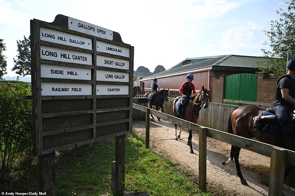 An old sign shows which Gallops are open that day, as some riders head out for a day in the sun