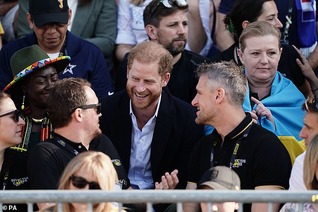 The engaged and excited-looking Duke talks to spectators during the games