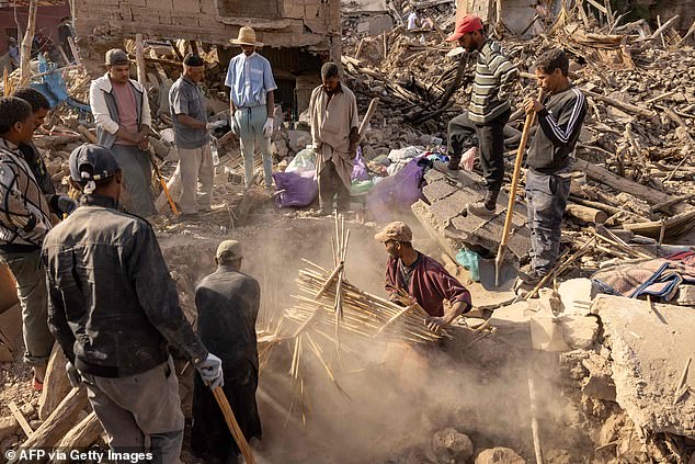 Volunteers dig through the rubble of collapsed houses in the village of Imi N'Tala near Amizmiz in central Morocco after the deadly force of 6.8 on the Richter scale, September 10, 2023