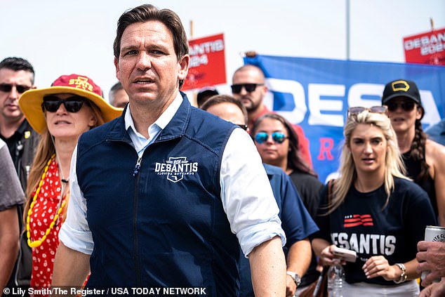 Florida Governor Ron DeSantis arrives at an Iowa State Wrestling tailgate before the Cy-Hawk football game at Jack Trice Stadium on Saturday