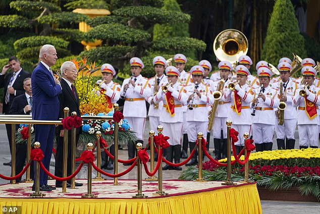 President Joe Biden (left) participates in a welcome ceremony hosted by Vietnam Communist Party Secretary General Nguyen Phu Trong (right) at the Presidential Palace in Hanoi, Vietnam, on Sunday afternoon