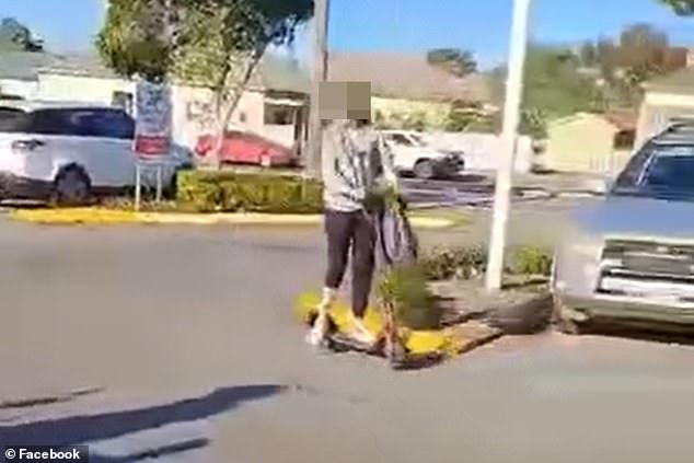 Footage from the nail salon shows one of the teens riding a scooter while telling a worker: 'Try to catch me with this f**king stupid c**t'