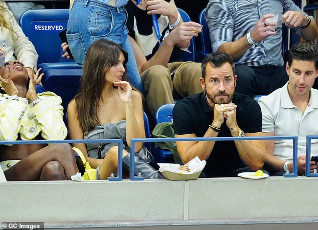 Snacks: The pair were sharing fries while watching the drama on the field