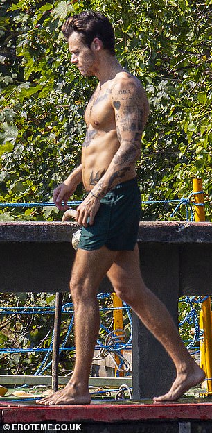 Unbelievable: Harry showed off his toned six-pack as he stepped out in North London