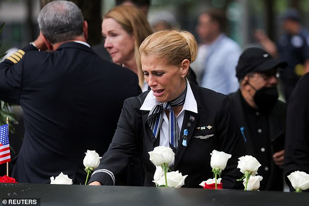 Sara Nelson, a United Flight Attendant from Boston who lost nine friends on Flight 175, is seen mourning at the memorial at Ground Zero Monday morning