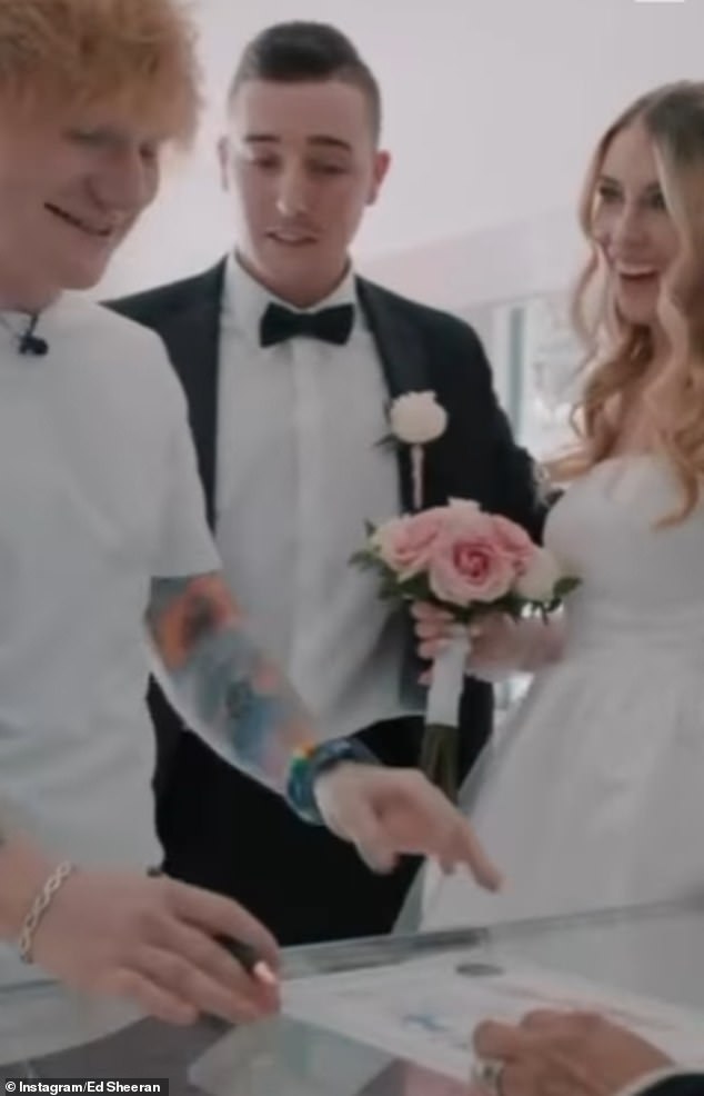 Here we go: Sheeran appeared to sign the certificate after the couple exchanged vows