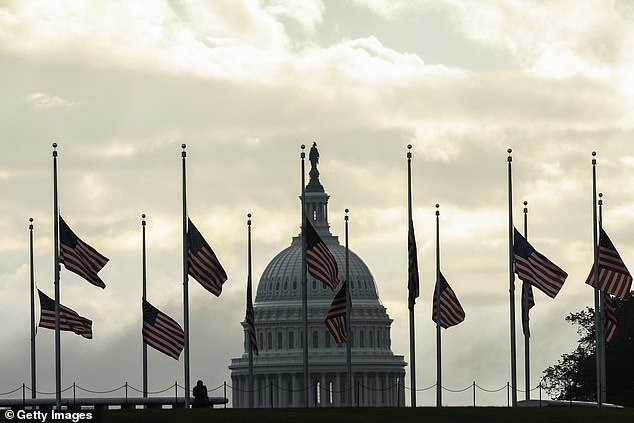 American flags fly at half-staff around the Washington Monument on the National Mall to mark the 22nd anniversary of the September 11 terrorist attacks