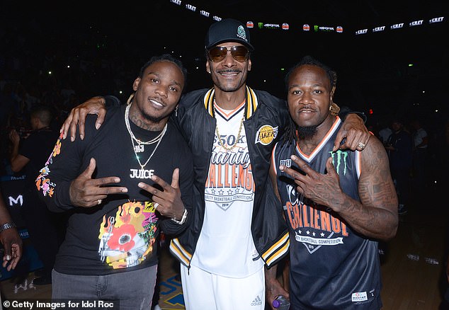 Jones (right), pictured with Snoop Dogg (center) and Chris Johnson in July 2019