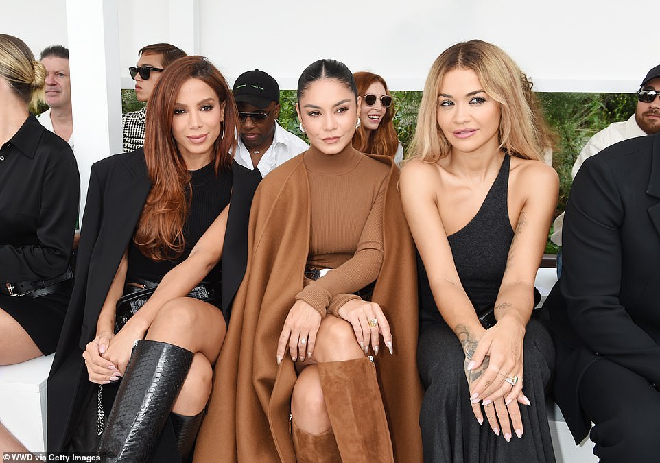 Inside the show: From left to right, singer Anitta, Vanessa Hudgens and Rita Ora during Michael Kors Spring 2024 Ready To Wear Runway Show at Domino Park in Brooklyn, New York