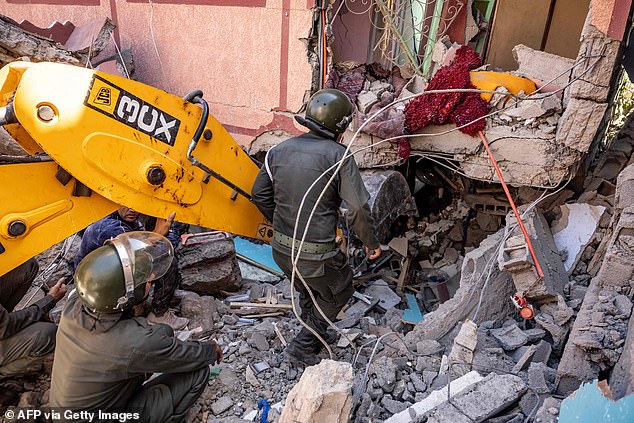 Desperate: Rescuers are still searching for survivors, with some in remote areas forced to dig with their bare hands as heavy lifting machines (pictured) cannot reach them