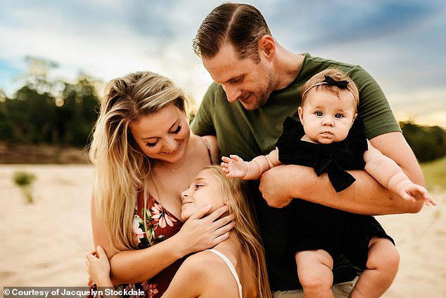 Pictured above is Isla with her mother Jacquelyn Stockdale and her father and sister.  The family has fought to get her treatment for the disease