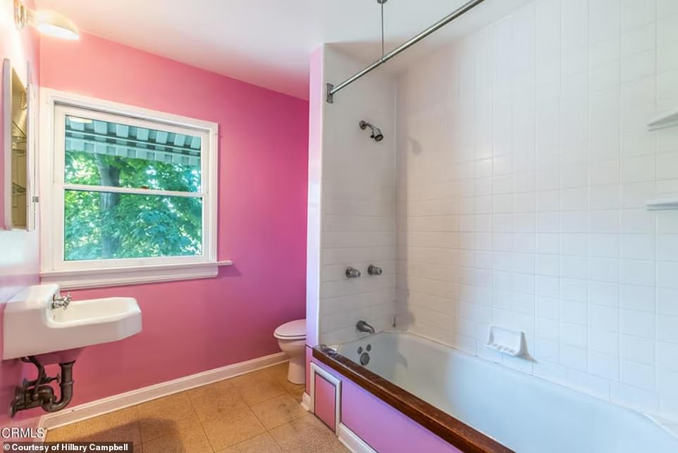 The third unit has 'one bed and one bathroom, living room and kitchen' and all three are decorated in vibrant colors, like this Barbie pink bathroom wall