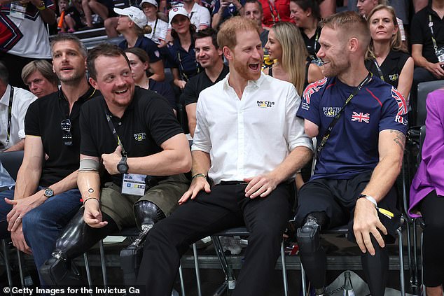 Harry was seen laughing and joking with other fans during the match which Team USA ultimately won 21-13 and took home the gold medal