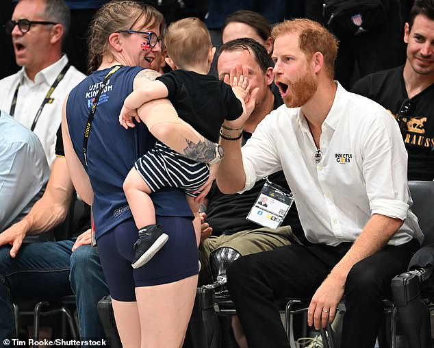 The Duke was happy to chat with other spectators while giving a little high-five