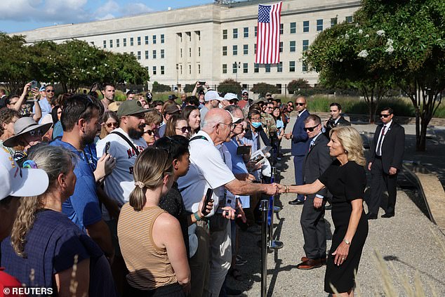 Jill Biden shakes hands with those who attended the ceremony