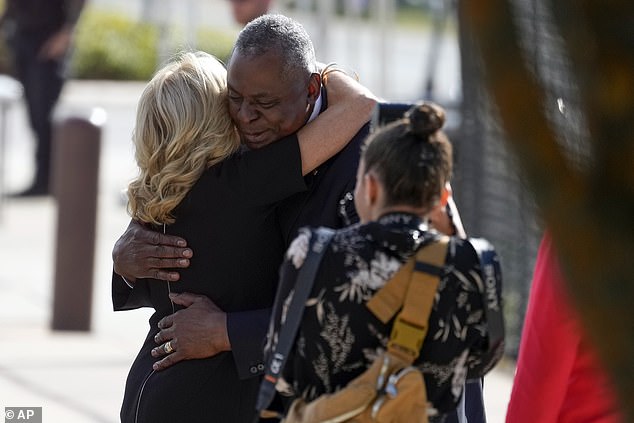 Jill Biden hugs Secretary of Defense Lloyd Austin