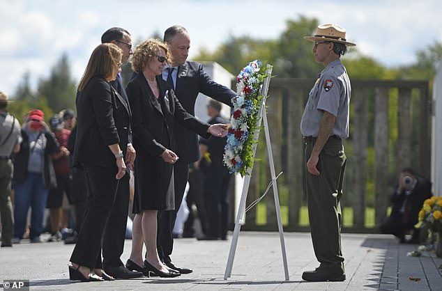 Laying a wreath in Shanksville are Pennsylvania First Lady Lori Shapiro, Governor Josh Shapiro, Deborah Borza (mother of Flight 93 victim Deora Frances Bodley), Second Gentleman Douglas Emhoff and park ranger David M. Schmitt