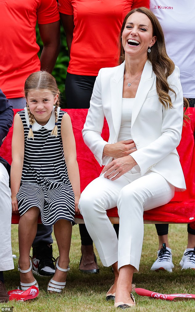 One of Kate's most beloved Alexander McQueen pieces is her white suit with sharp tailoring (pictured at the Commonwealth Games with Princess Charlotte in 2022)