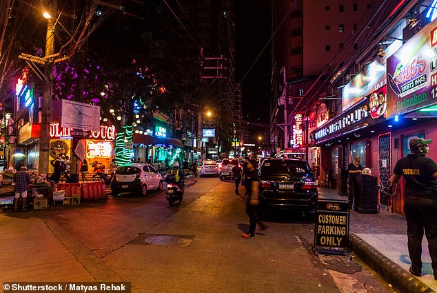 The violence has become so intense that many karaoke bar owners in the Asian country have removed the song from their repertoire.  Above is a main street in Manila