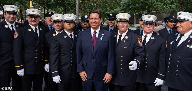 Florida Governor Ron DeSantis, pictured with firefighters at today's 9/11 memorial service in New York, has helped lead the Republican charge over 'wokeness' in the military