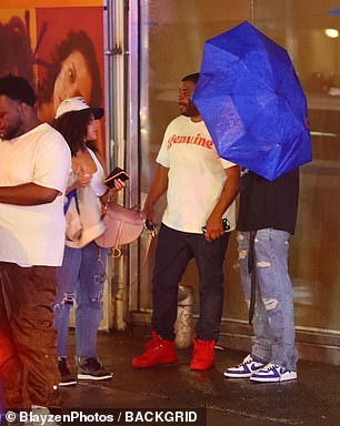 The R&B singer and the alleged member of his crew were involved in the shouting and were seen outside the club on a rainy morning with a group of scantily clad women