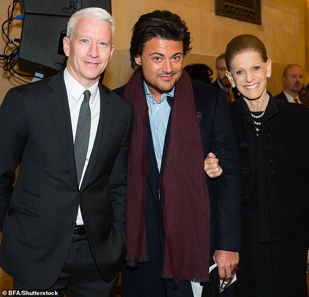 Anderson Cooper is seen in February 2017 with Annette de la Renta (far right) and Italian opera singer Vittorio Griggolo