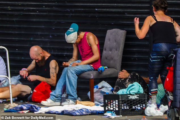 In July, addicts are seen sitting on the streets of Kensington