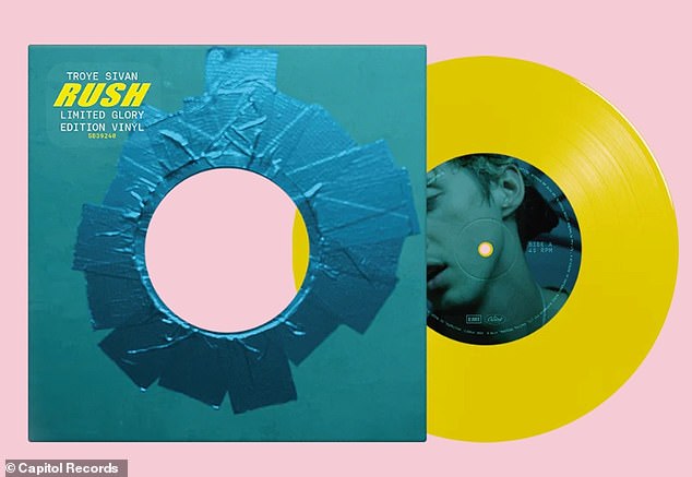 The cover for the record (shown) is designed to look like a glory hole, a hole in a wall or door used for sexual activity