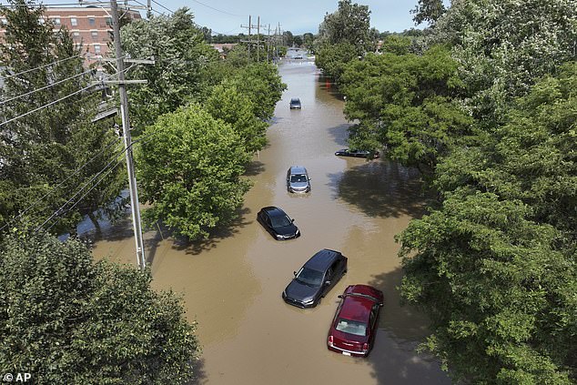 Cars are stranded in water in Canton, Michigan, after storms left parts of Detroit flooded in August