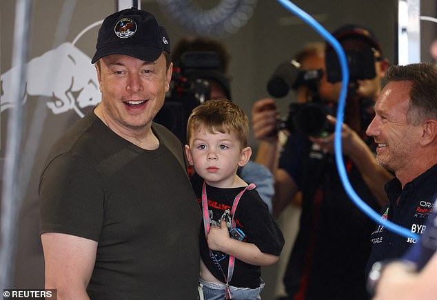 Musk holds his son together with Red Bull team boss Christian Horner in the garage for the Formula 1 Grand Prix of Miami