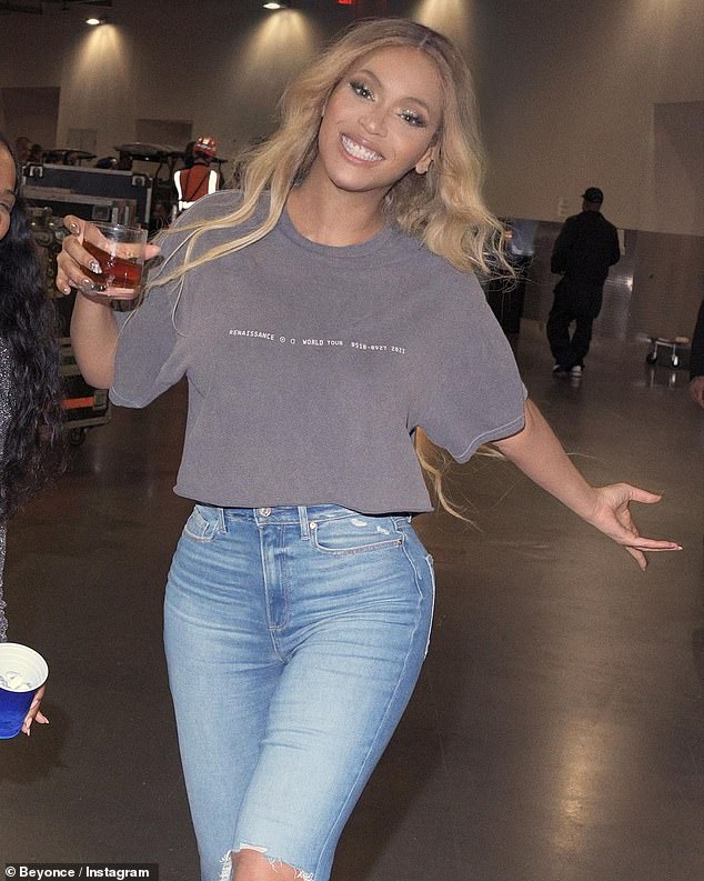 Beaming: Beyoncé appeared cheerful before taking the stage