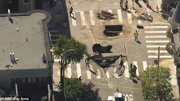 The sinkhole appeared overnight in the upscale neighborhood at the intersection of Fillmore and Green Street