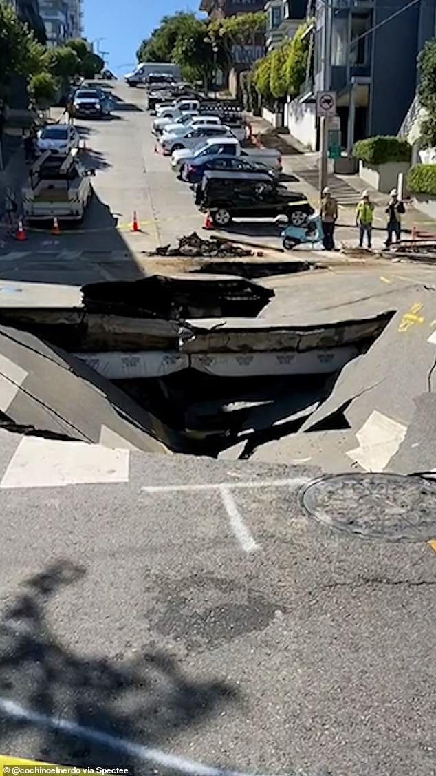 The sinkhole appeared Monday night after a nearby water main burst the night before