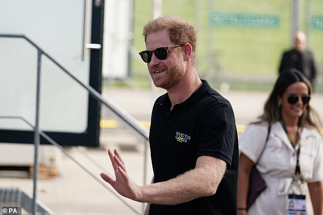 The Duke of Sussex waves during a walk in the Merkur Spiel-Arena in Düsseldorf today