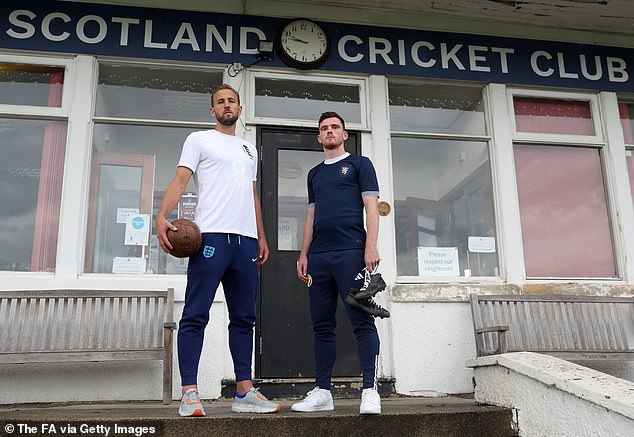 England's Harry Kane and Scotland's Andy Robertson pose in unique warm-up shirts to mark the 150th Anniversary Heritage Match at Hampden Park on Tuesday evening