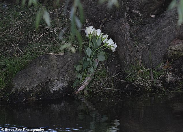 Flowers were placed near the spot where the elderly couple's car fell into the river