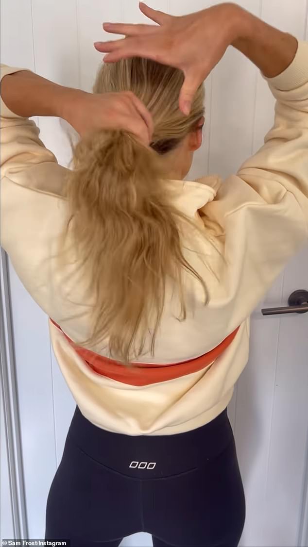 The footage shows Sam, 34, stroking her long blonde locks with her back to the camera as Todrick Hall's club hit Nails, Hair, Hips, Heels plays in the background.