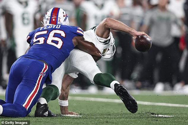 The 39-year-old Rodgers appeared to have his left foot stuck in the turf when Leonard Floyd knocked him down