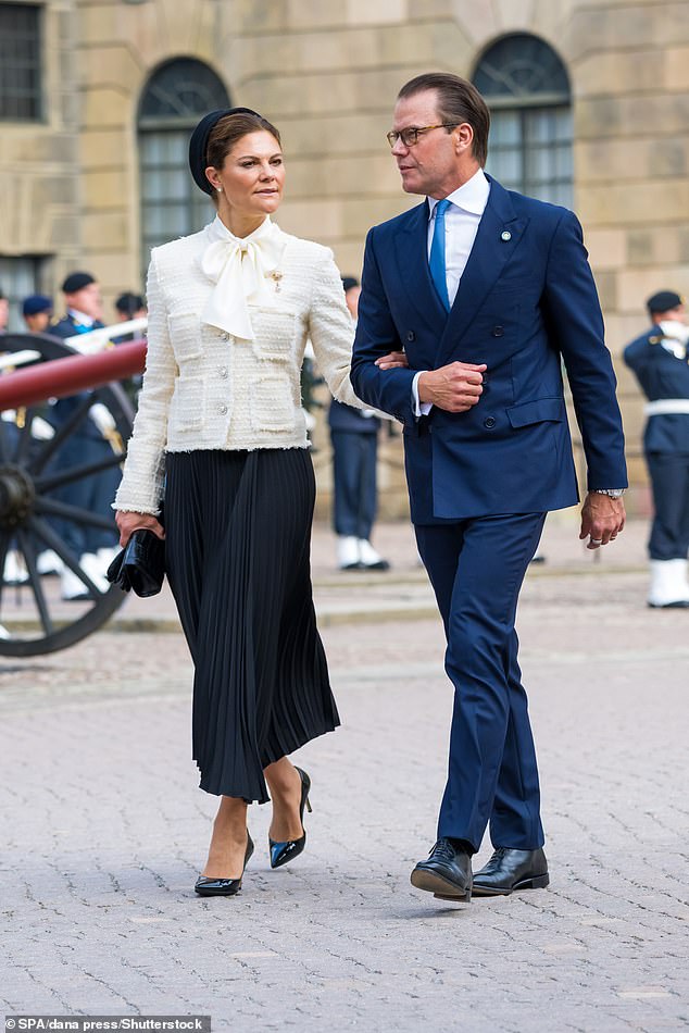 Side by side: Sweden's heir to the throne, 45, held her husband's arm tightly as they entered the church service